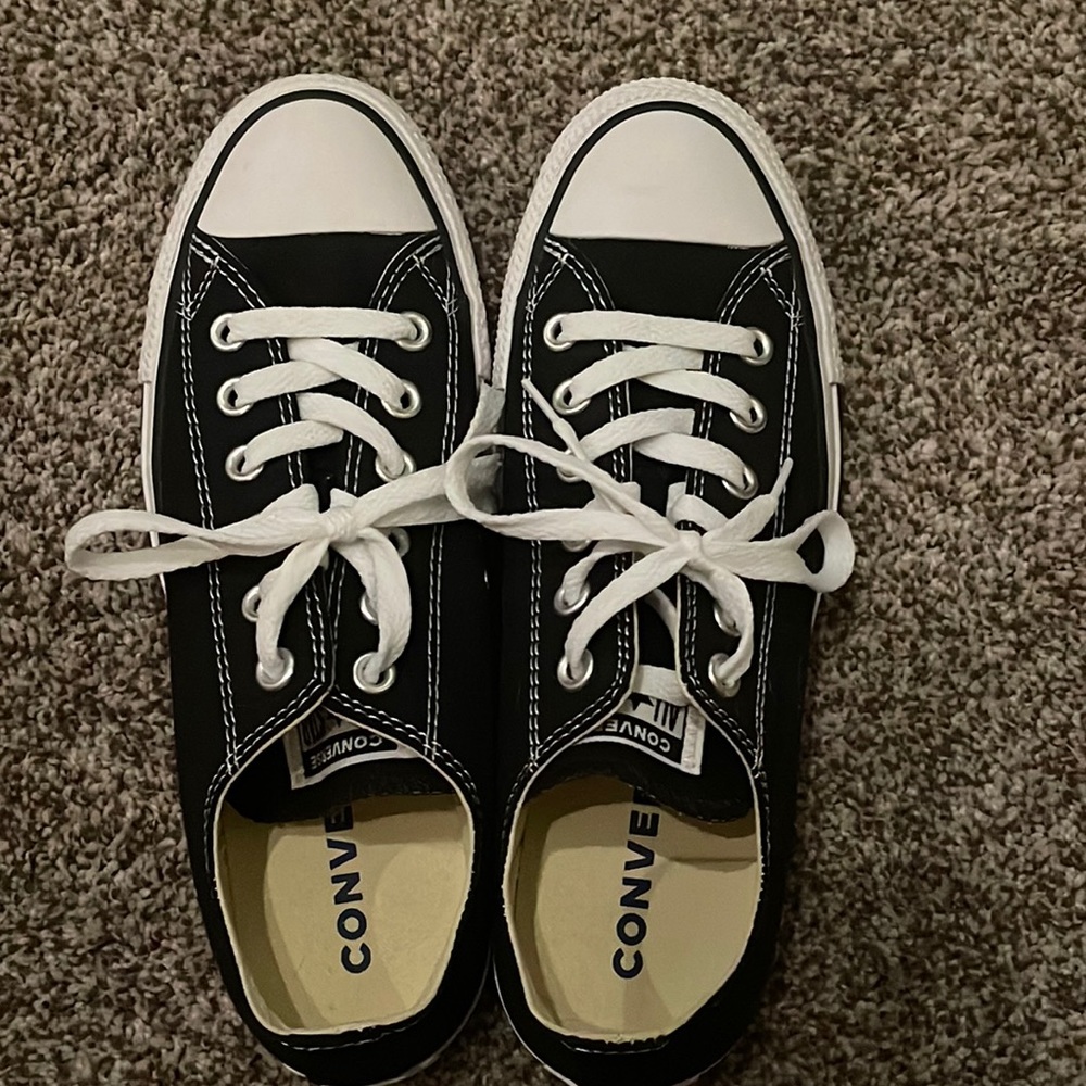 These are Converse in the color black and a women’s 8
